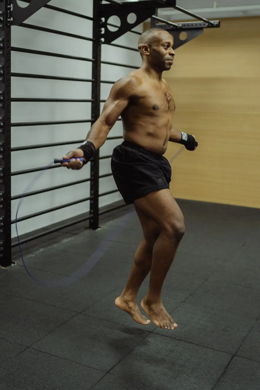 Person mid-workout with a jump rope