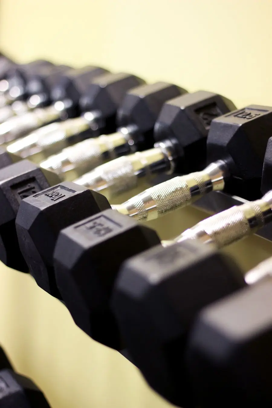 Hex dumbbells racked in a gym